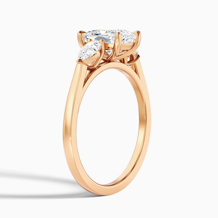 Haley 1 Carat Three Stone Ring with Pear Side Stones and an Elongated Cushion Lab Grown Diamond in 10k Rose Gold