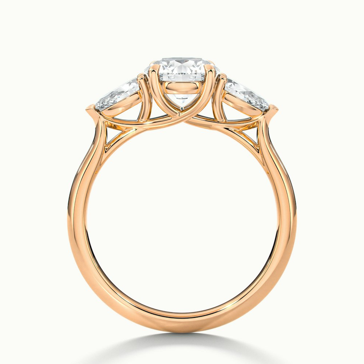 Amaya 1 Carat Round 3 Stone Moissanite Diamond Ring With Pear Side Stone in 14k Rose Gold