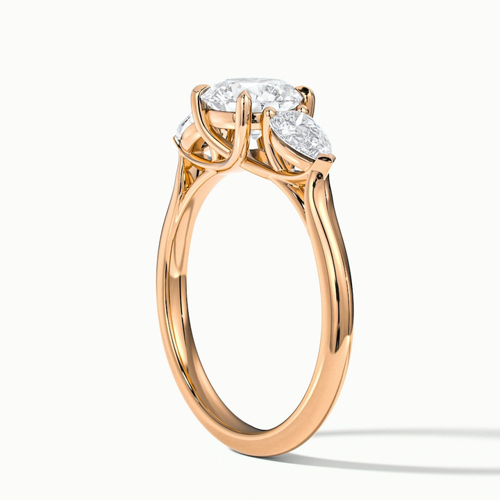 Amaya 4 Carat Round 3 Stone Moissanite Diamond Ring With Pear Side Stone in 18k Rose Gold