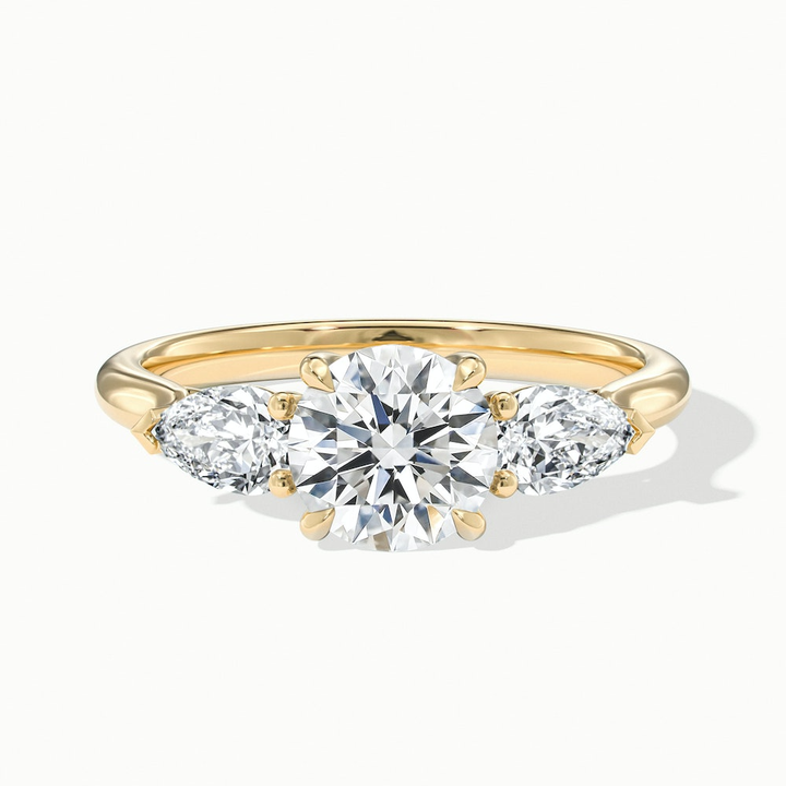 Amaya 3.5 Carat Round 3 Stone Moissanite Diamond Ring With Pear Side Stone in 14k Yellow Gold