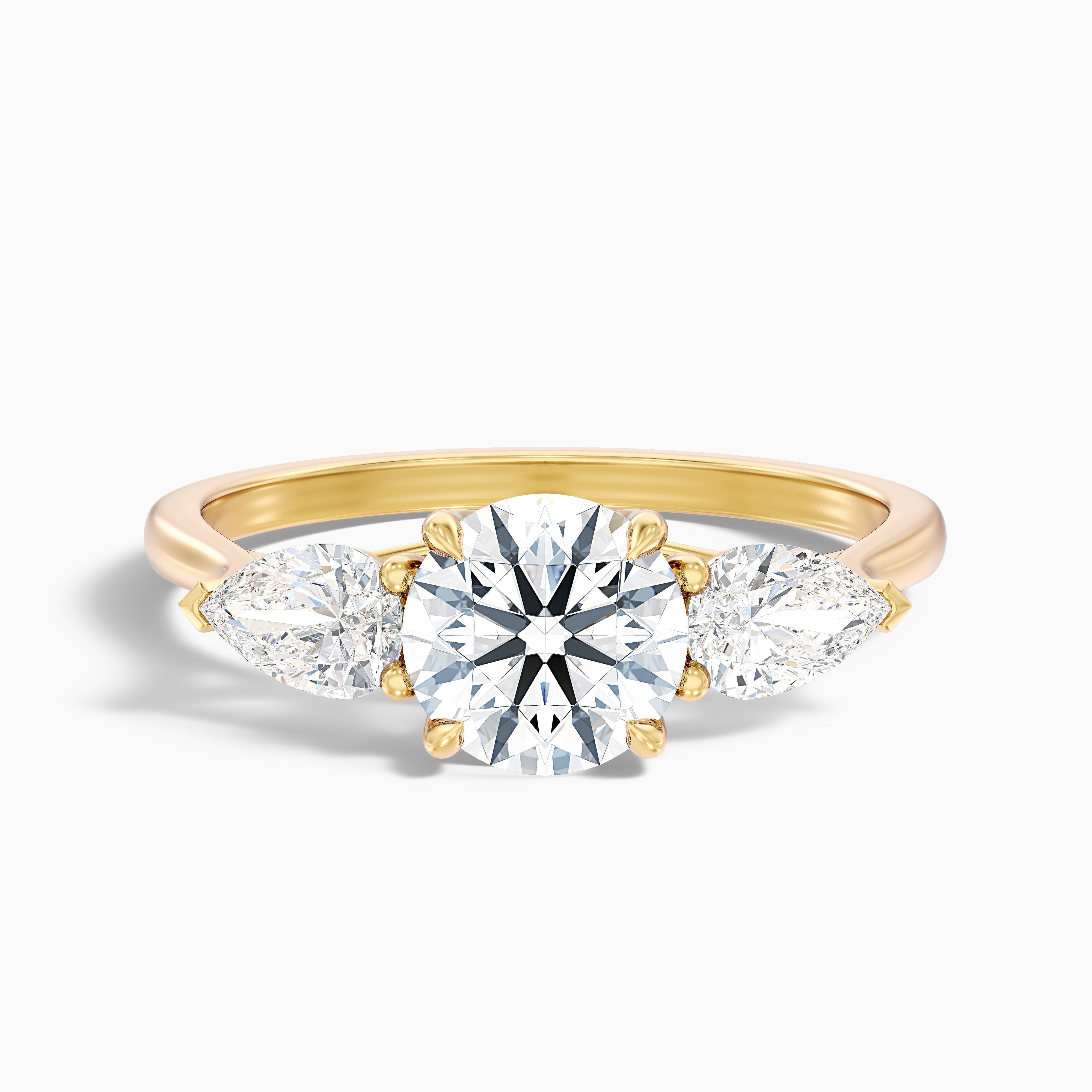 Amaya 2 Carat Round 3 Stone Moissanite Diamond Ring With Pear Side Stone in 10k Yellow Gold