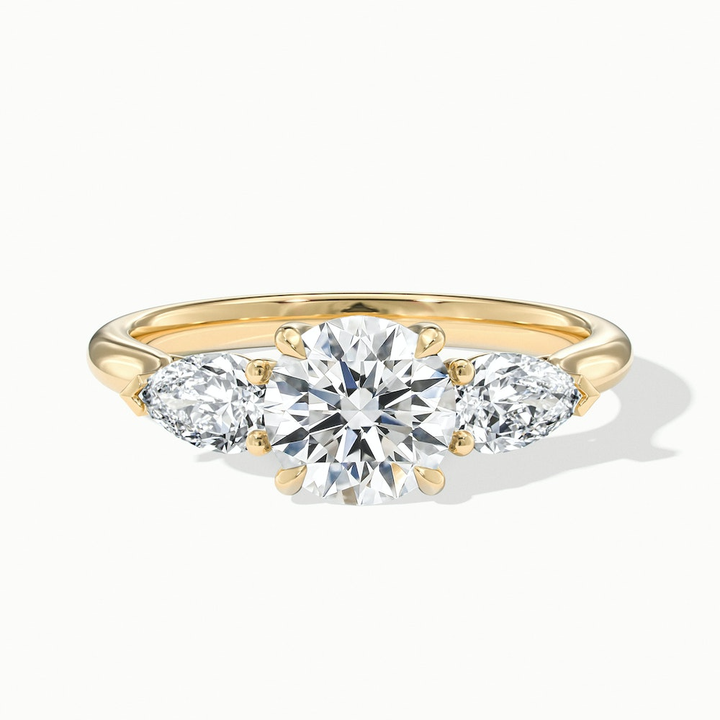 Amaya 3.5 Carat Round 3 Stone Moissanite Diamond Ring With Pear Side Stone in 10k Yellow Gold