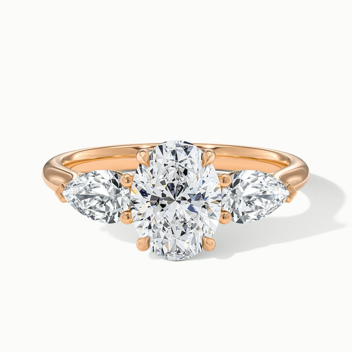Isa 1.5 Carat Three Stone Oval Halo Moissanite Engagement Ring in 18k Rose Gold