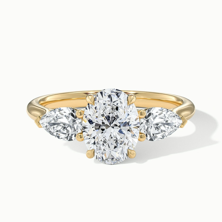 Isa 1.5 Carat Three Stone Oval Halo Moissanite Engagement Ring in 10k Yellow Gold