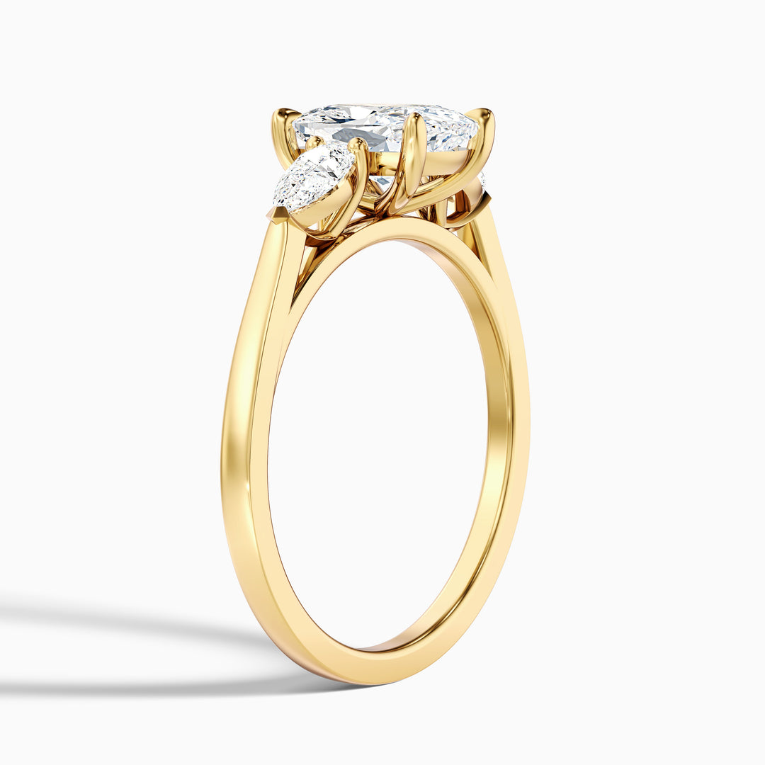 Haley 1 Carat Three Stone Ring with Pear Side Stones and an Elongated Cushion Moissanite Diamond in 10k White Gold